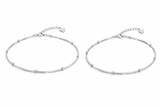 Two silver payal 
on a white background