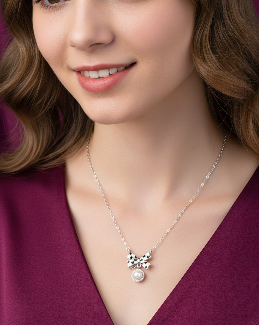 Close-up of a woman wearing a necklace with a pendant