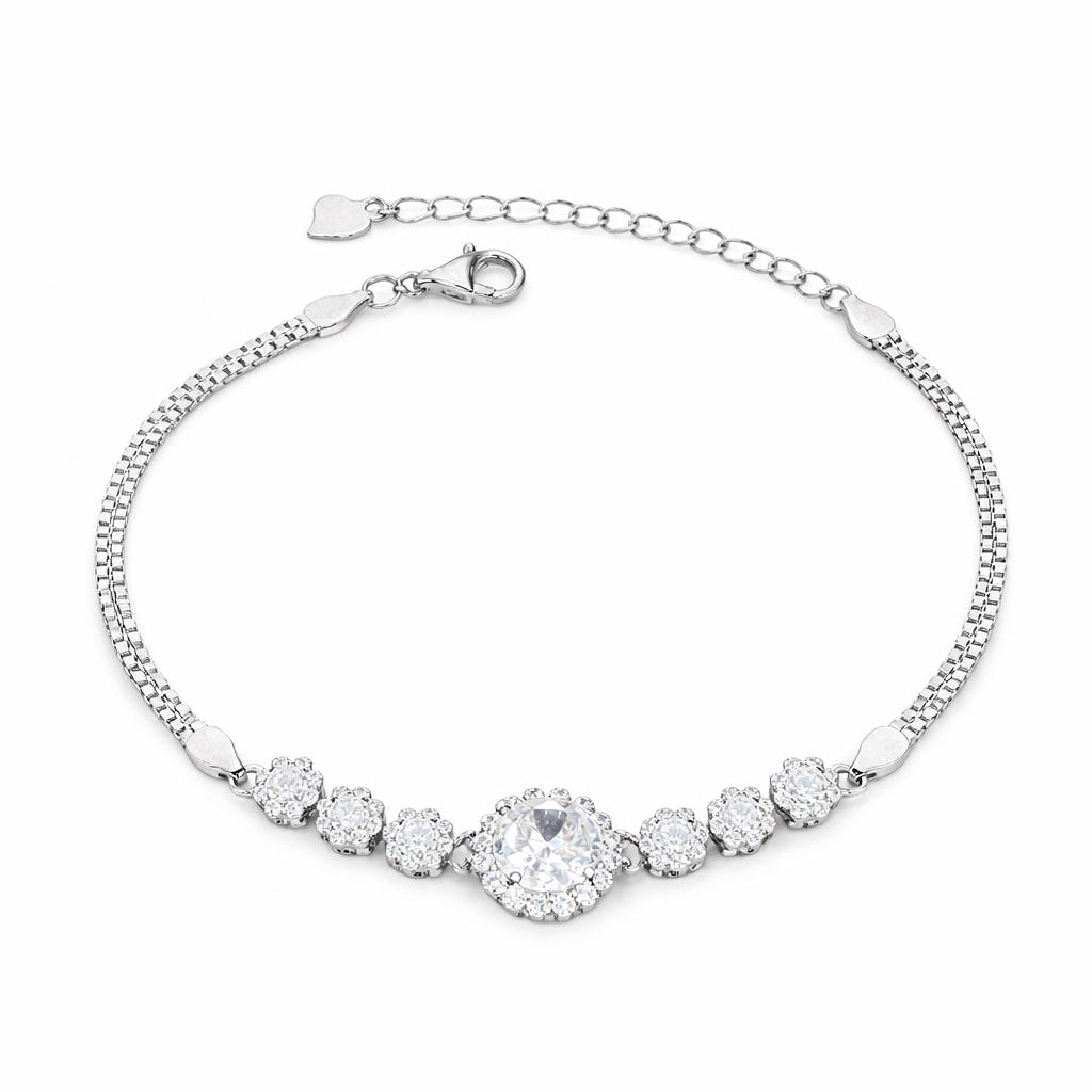 Silver bracelet with clear gemstones on a white background