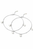 Two pearl anklets on a white background