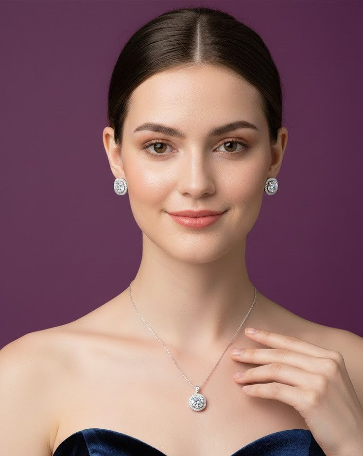 Woman wearing diamond earrings and necklace against a purple background