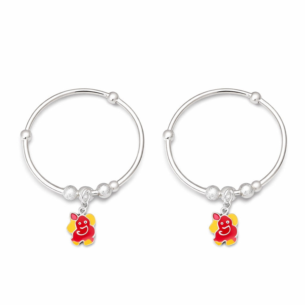 silver baby kada with ganesha charms on a white background