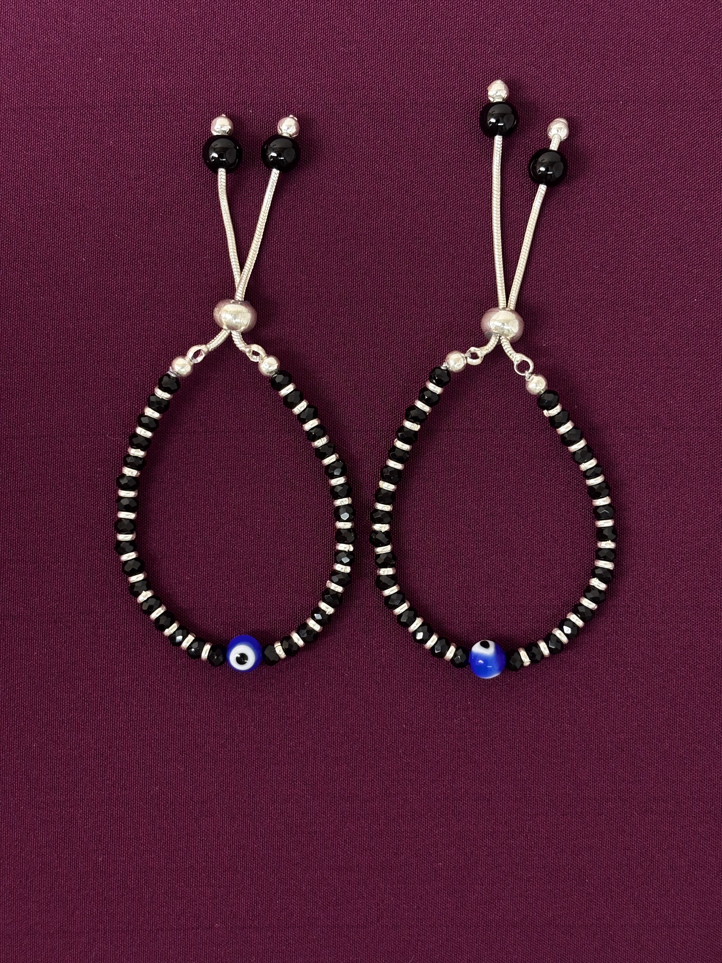 Pair of beaded bracelet on a purple background