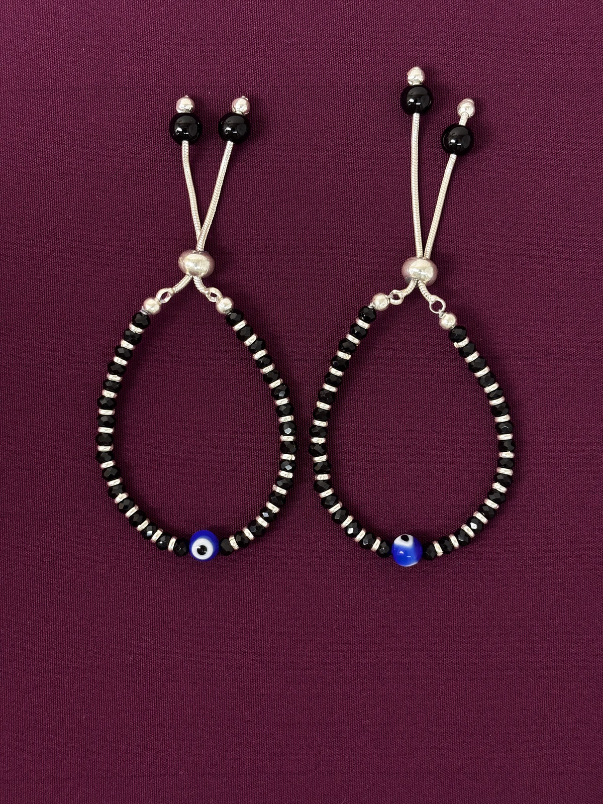 Pair of beaded bracelet on a purple background
