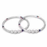 silvedr baby kada  with red, white, and blue meena on a white background