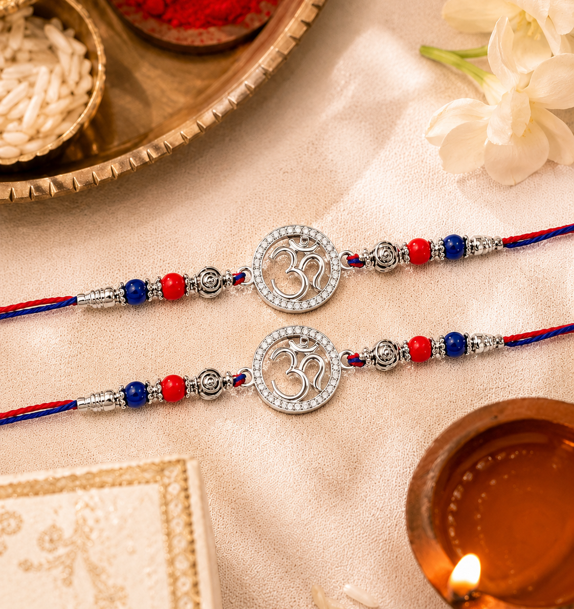 silver-om-rakhi-pair