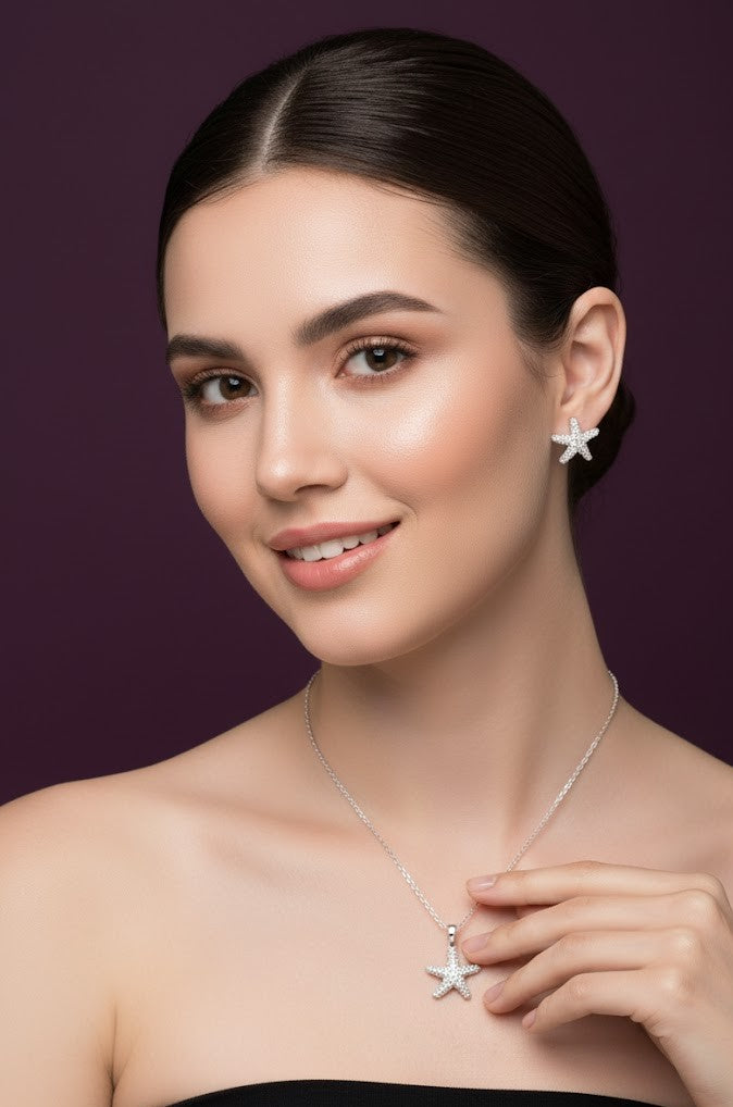 Woman wearing a 925 silver starfish shaped earring and necklace set