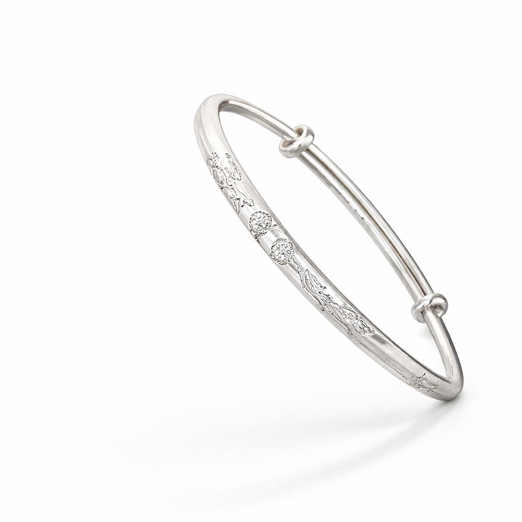 Silver bracelet with small diamonds on a white background