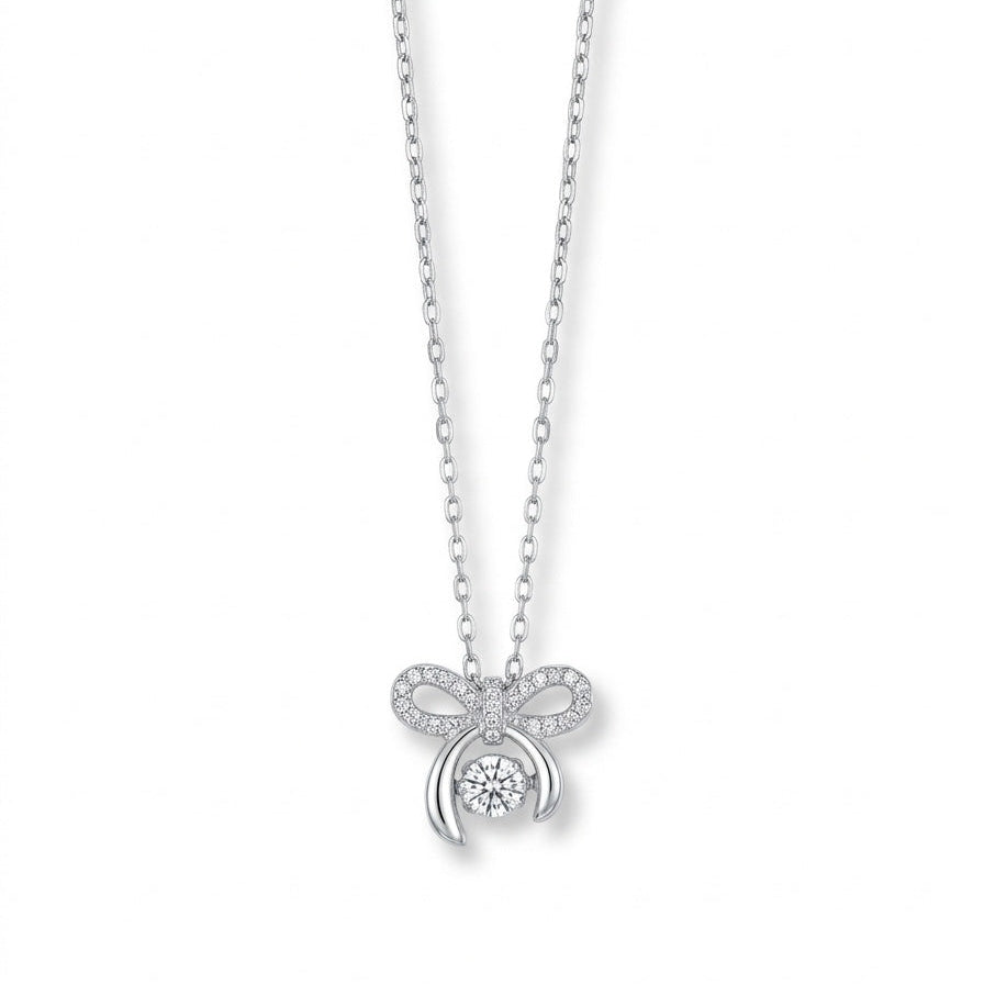 Silver necklace with a bow-shaped pendant on a white background