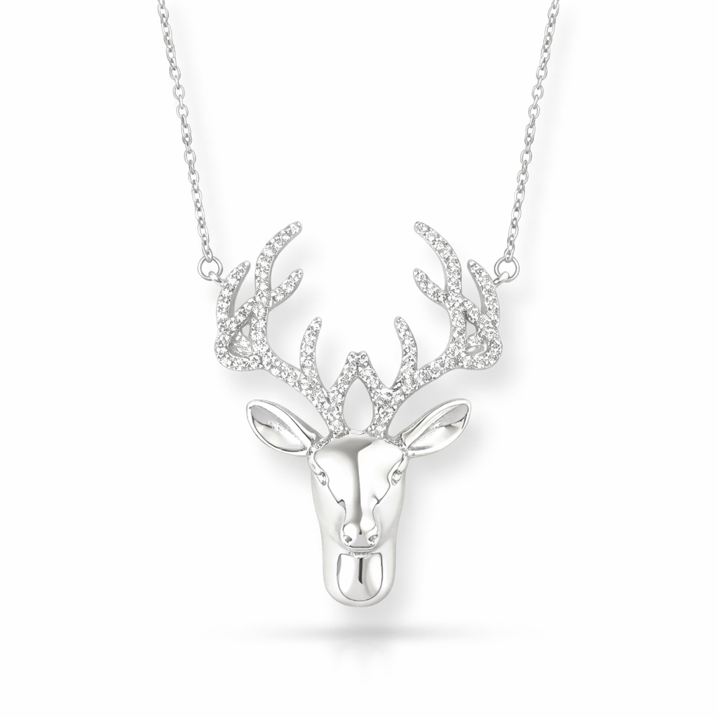 Silver deer head necklace on a white background