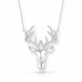 Silver deer head necklace on a white background