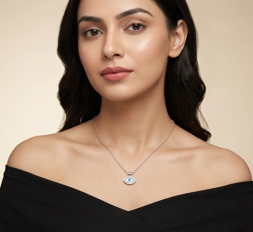 Woman wearing a necklace with an eye pendant on a beige background