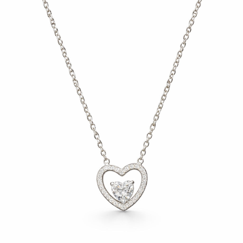 Heart-shaped diamond necklace on a white background