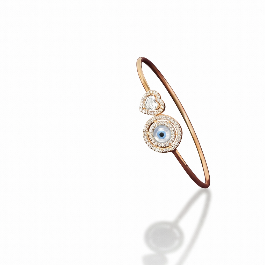 Rose gold bracelet with a central eye design on a white background