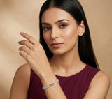 Woman wearing a bracelet on a beige background