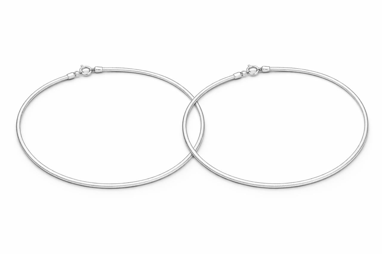 Pair of silver anklet on a white background