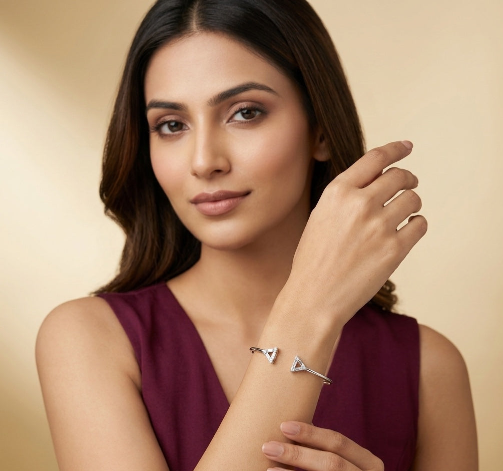 Woman wearing a silver bracelet with a gold background