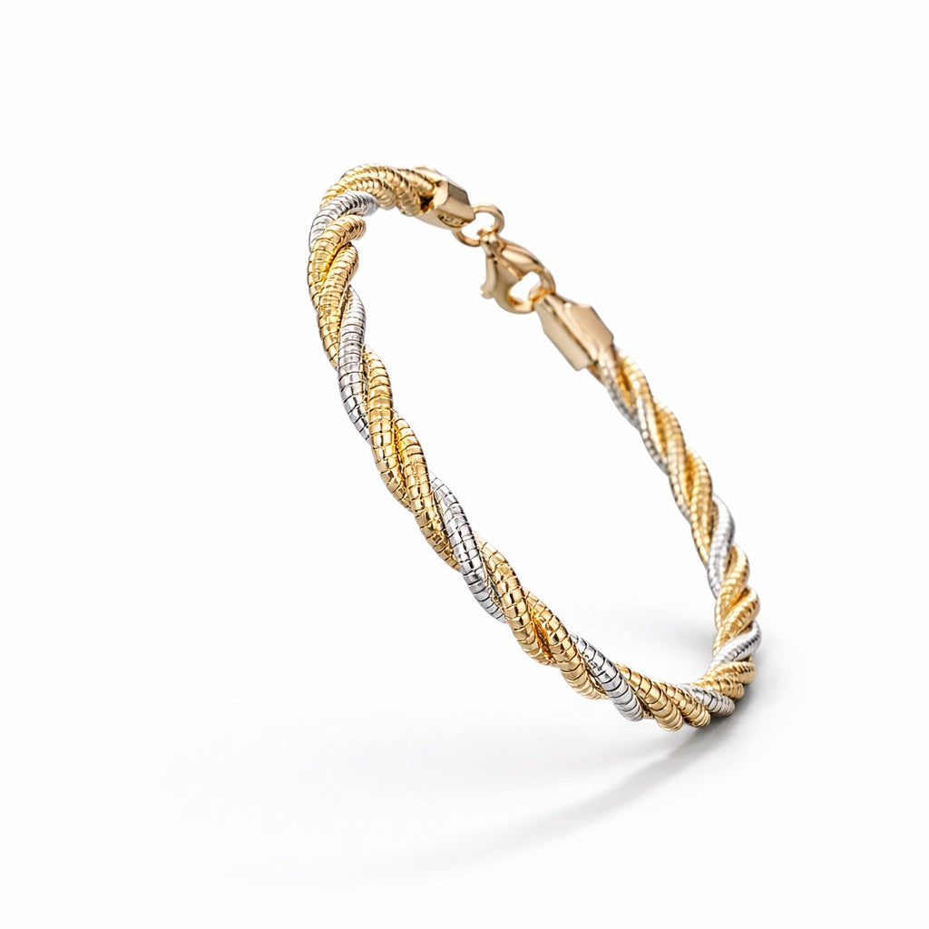 Two-tone gold bracelet on a white background