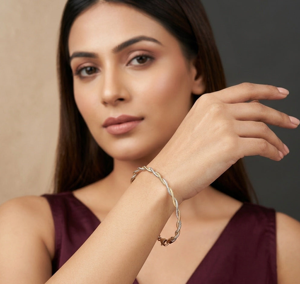 Woman wearing a silver bracelet on a neutral background